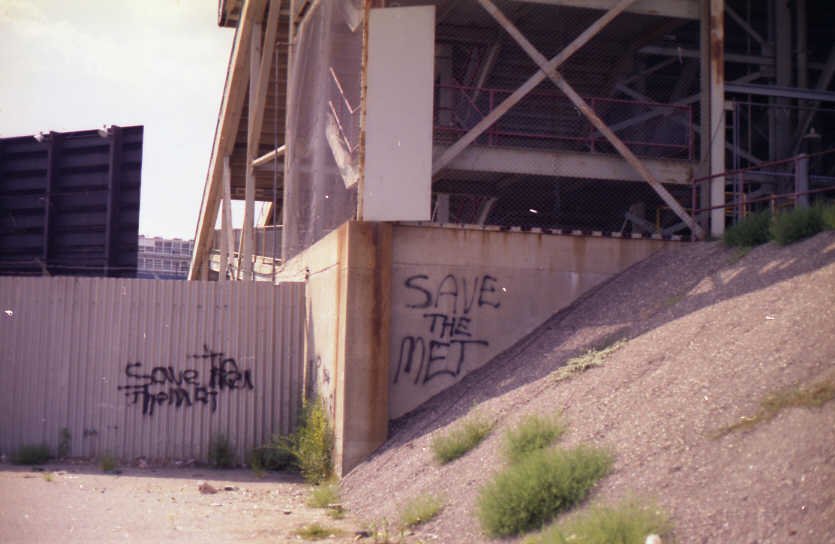 Abandoned: Wishful slogans painted outside the left field pavilion (Source: Robin Hanson)
